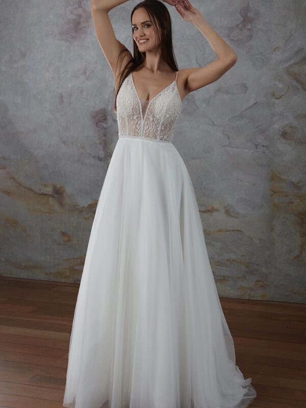 Robe de mariée élégante avec corsage en dentelle perlée et jupe fluide