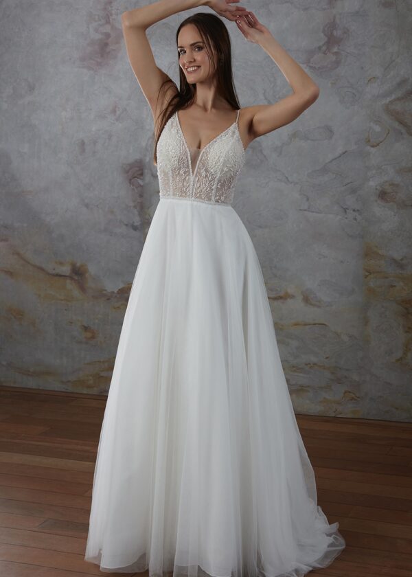 Robe de mariée élégante avec corsage en dentelle perlée et jupe fluide
