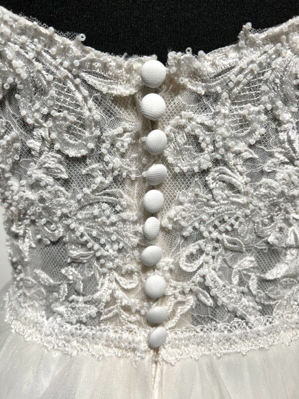 Robe de mariée trapèze Justin Alexander avec bustier cœur, bretelles tombantes, dentelle perlée et fente élégante