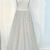 Robe de mariée princesse en dentelle brodée avec bustier structuré et jupe volumineuse fluide