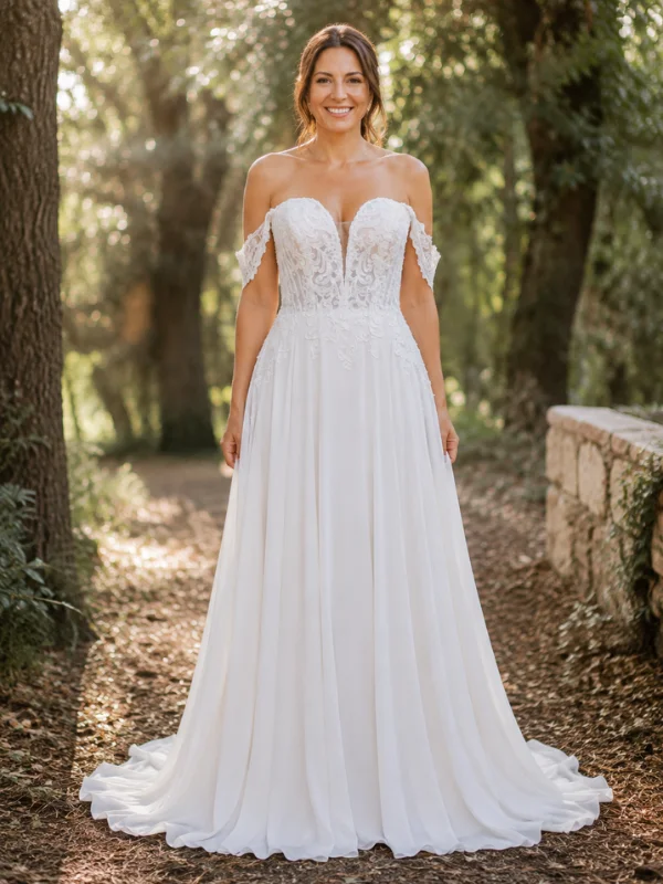 Robe de mariée trapèze Adriana Alier modèle Anahi en mousseline fluide, vue de face sur mannequin, soulignant son élégance épurée.